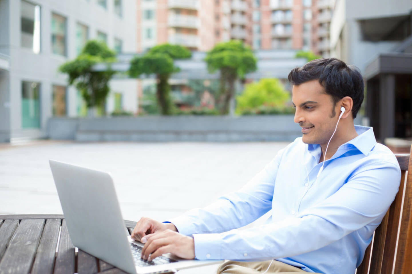 business, office, runplugged, Laptop, arbeiten, headphones, Kopfhörer, Musik, http://www.shutterstock.com/de/pic-198311093/stock-photo-closeup-portrait-young-handsome-man-in-blue-shirt-typing-away-listening-to-headphones-browsing.html  get the Runplugged App http://bit.ly/1lbuMA9 