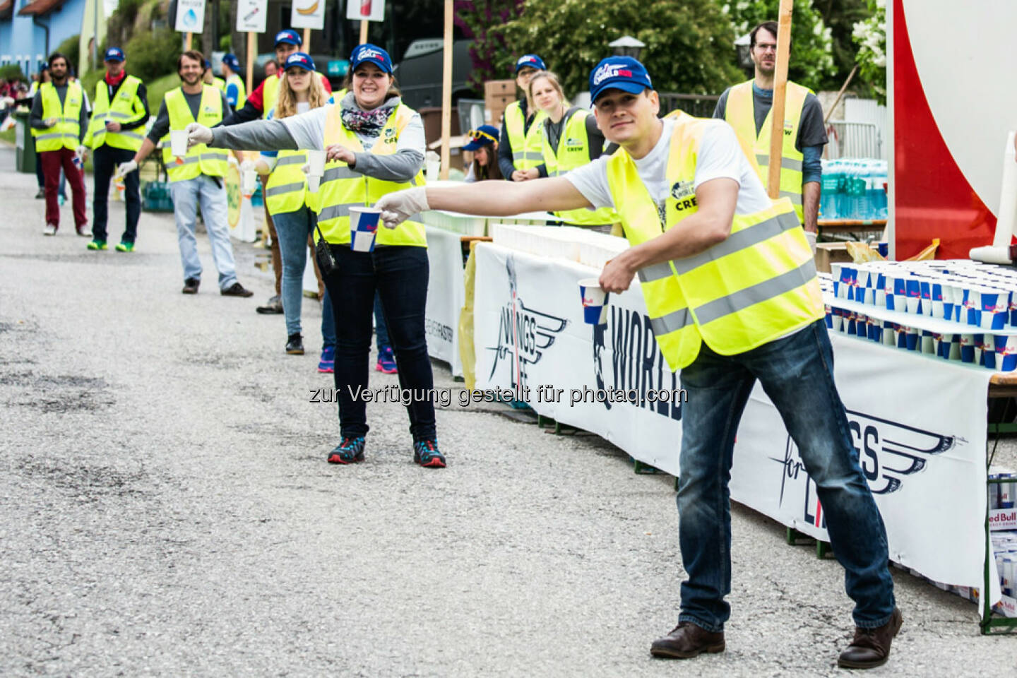 Volunteers hand out water to the participants at the Wings for Life World Run in St. Poelten, Austria on May, 3rd 2015. // Philipp Greindl for Wings for Life World Run // Please go to www.redbullcontentpool.com for further information. // 