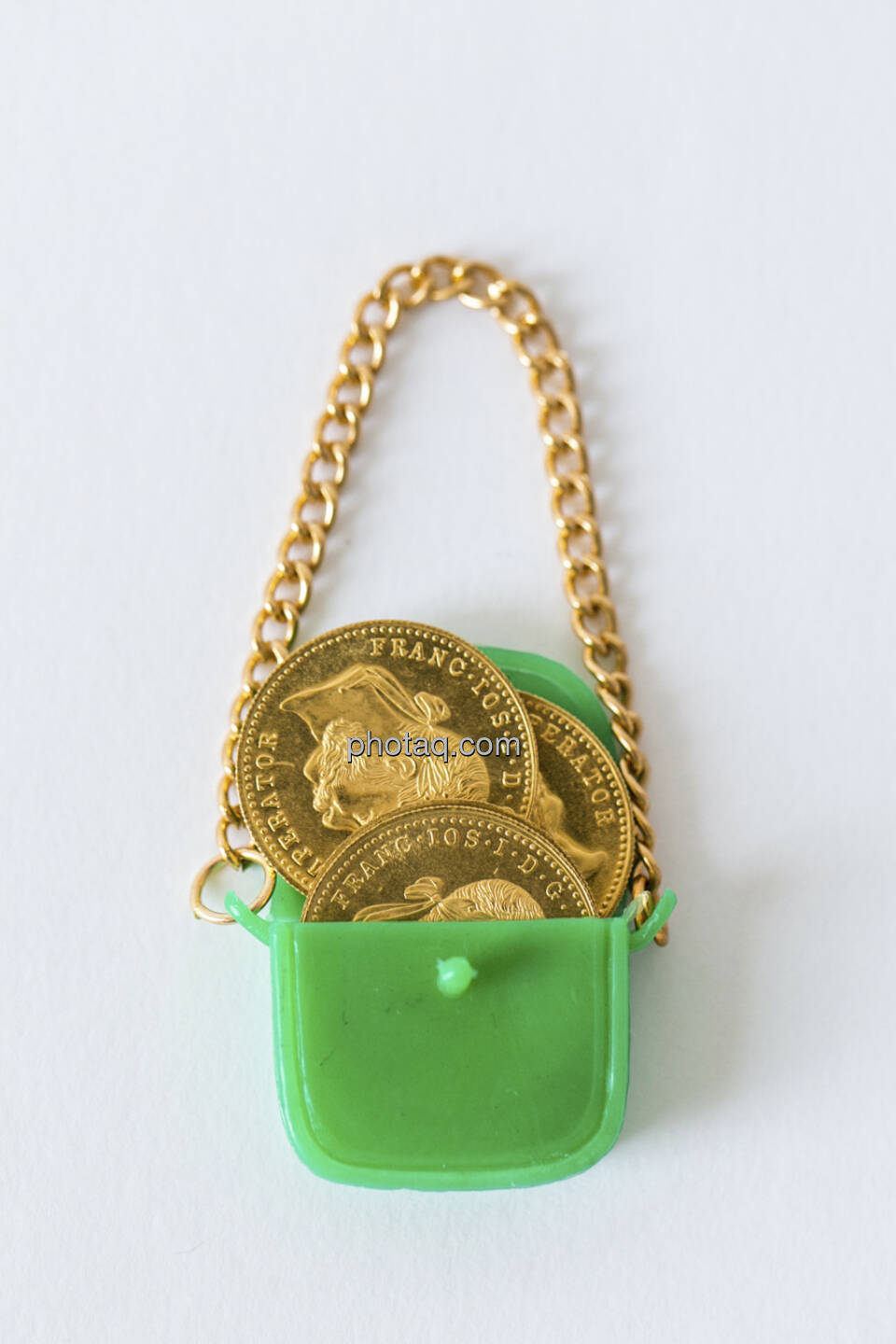 Die Taschen voll Gold, grüne Handtasche, Goldmünzen